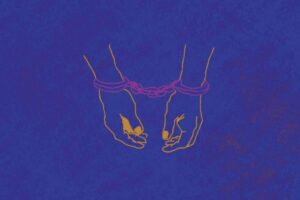 Ao centro da imagem, sobre um fundo roxo e texturizado, aparecem duas mãos algemadas.