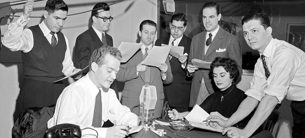 From left to right: José Quijano-Santos; Luis Marron; Hernando Solano; Jorge A. Carvallo, Luis Carlos Sanchez, Osvaldo Lopez Noguerol; Beatrix Alcapra Cuellar; and Guillermo Caram, members of the staff of the UN Radio Division are recording a special broadcast for the radio networks of the Latin American countries, at UN Headquarters in New York.