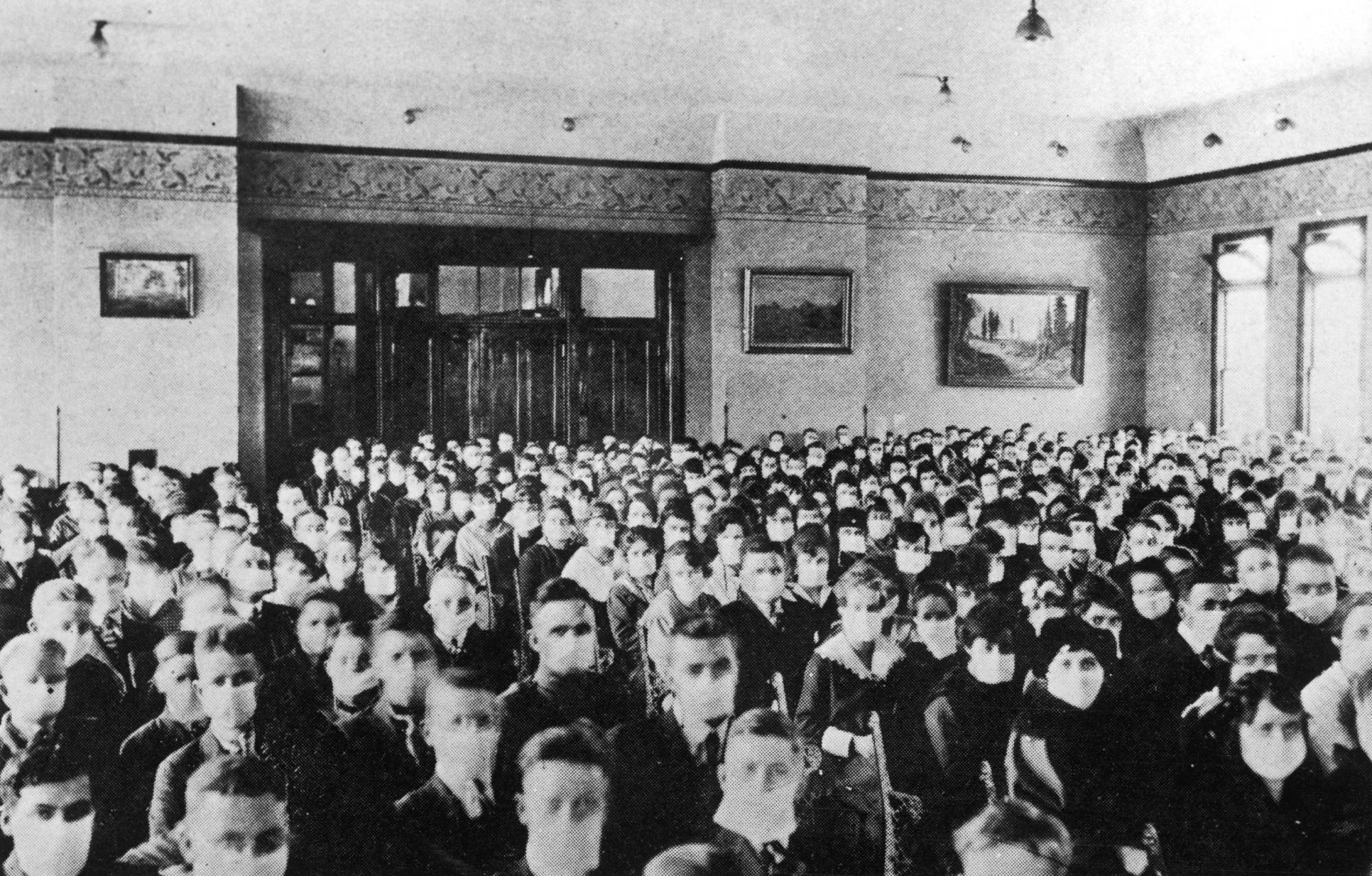 Archive photo of students wearing masks inside classroom.